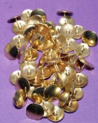 A collection of brass tacks; in Britain they would be called drawing pins
