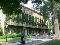The frontage of west college at Princeton University, covered in ivy.